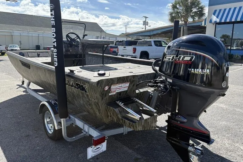 Slide: The Image of 2026 SeaArk Shadow 19 V Center Console boat with Yamaha engine on trailer. - 17