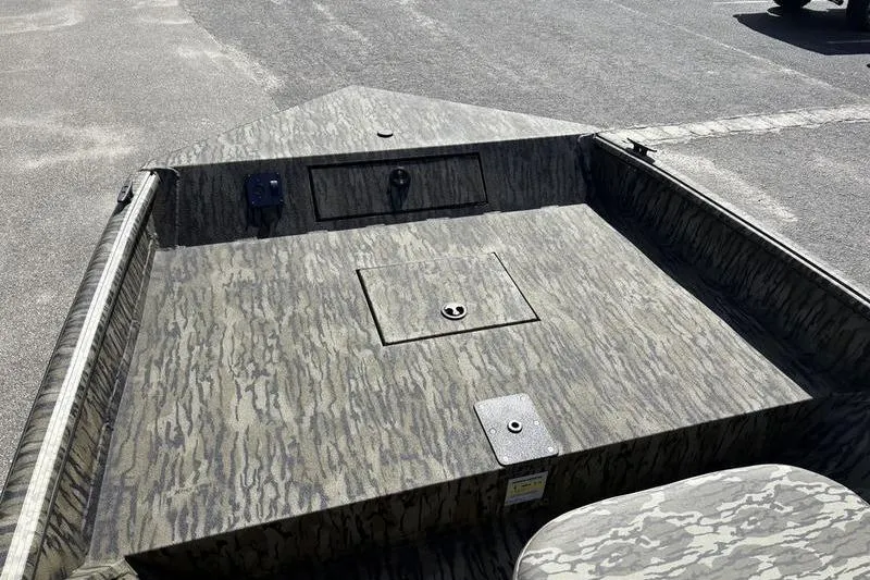 Slide: The Image of 2026 SeaArk Shadow 19 V Center Console boat with camo pattern deck. - 3