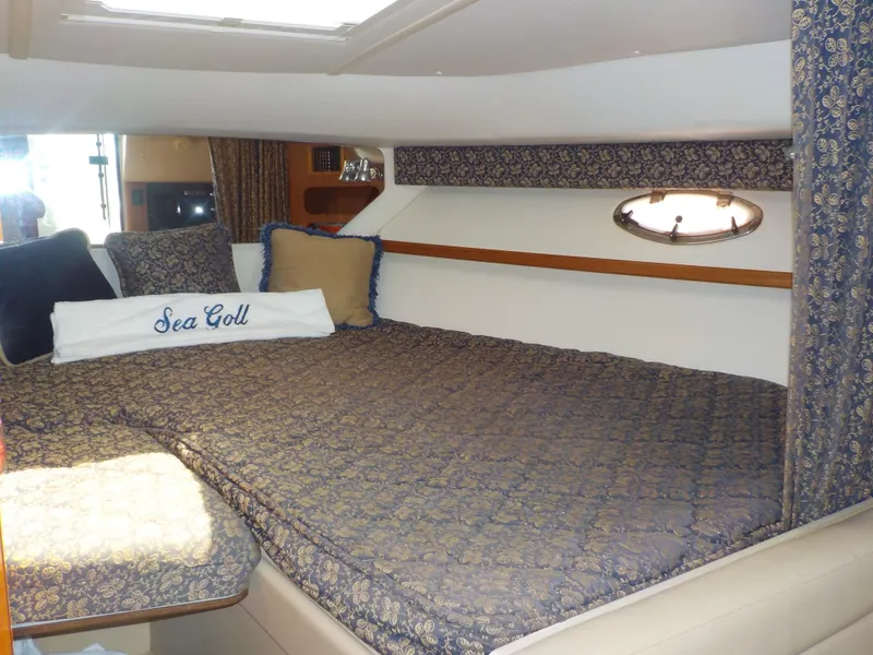 Slide: The Image of Luxurious cabin interior of 2003 Tiara Yachts 3100 Open with elegant bedding. - 11