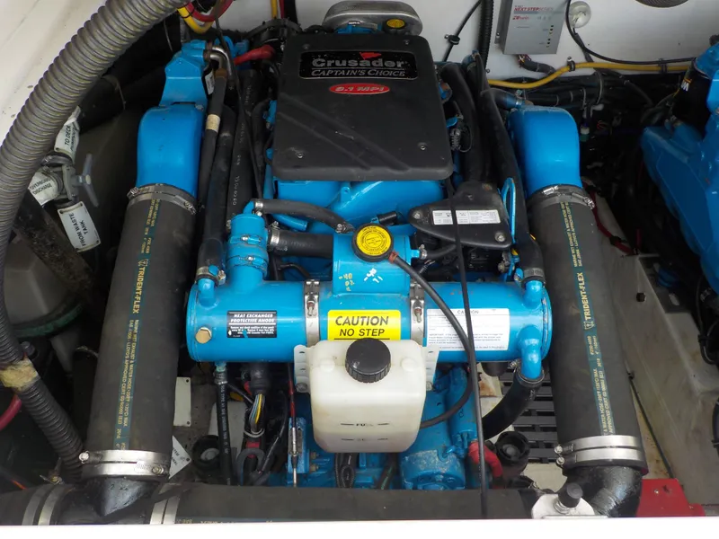 Slide: The Image of Engine compartment of a 2003 Tiara Yachts 3100 Open, featuring a Crusader engine. - 18