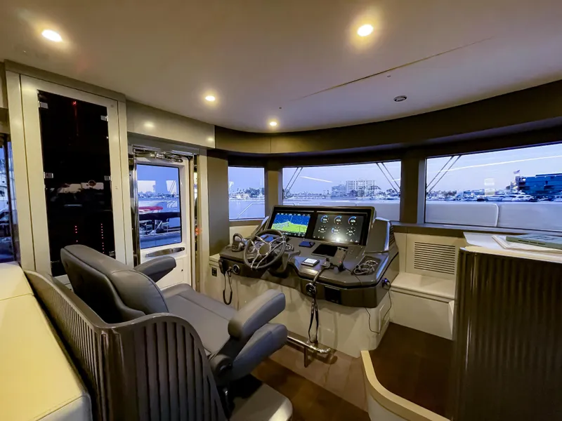 Slide: The Image of Modern helm station of 2023 Sirena 68 yacht with advanced navigation systems. - 12