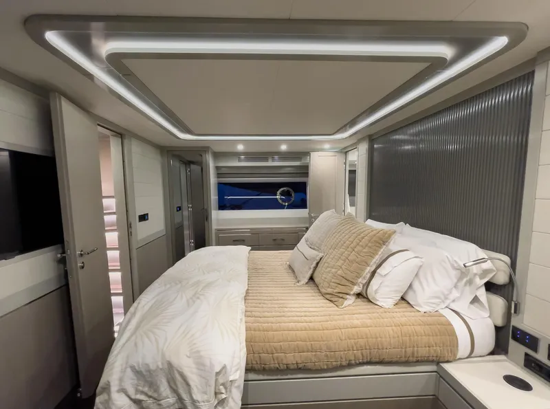 Slide: The Image of Luxurious bedroom interior of 2023 Sirena 68 yacht with modern design and ambient lighting. - 13