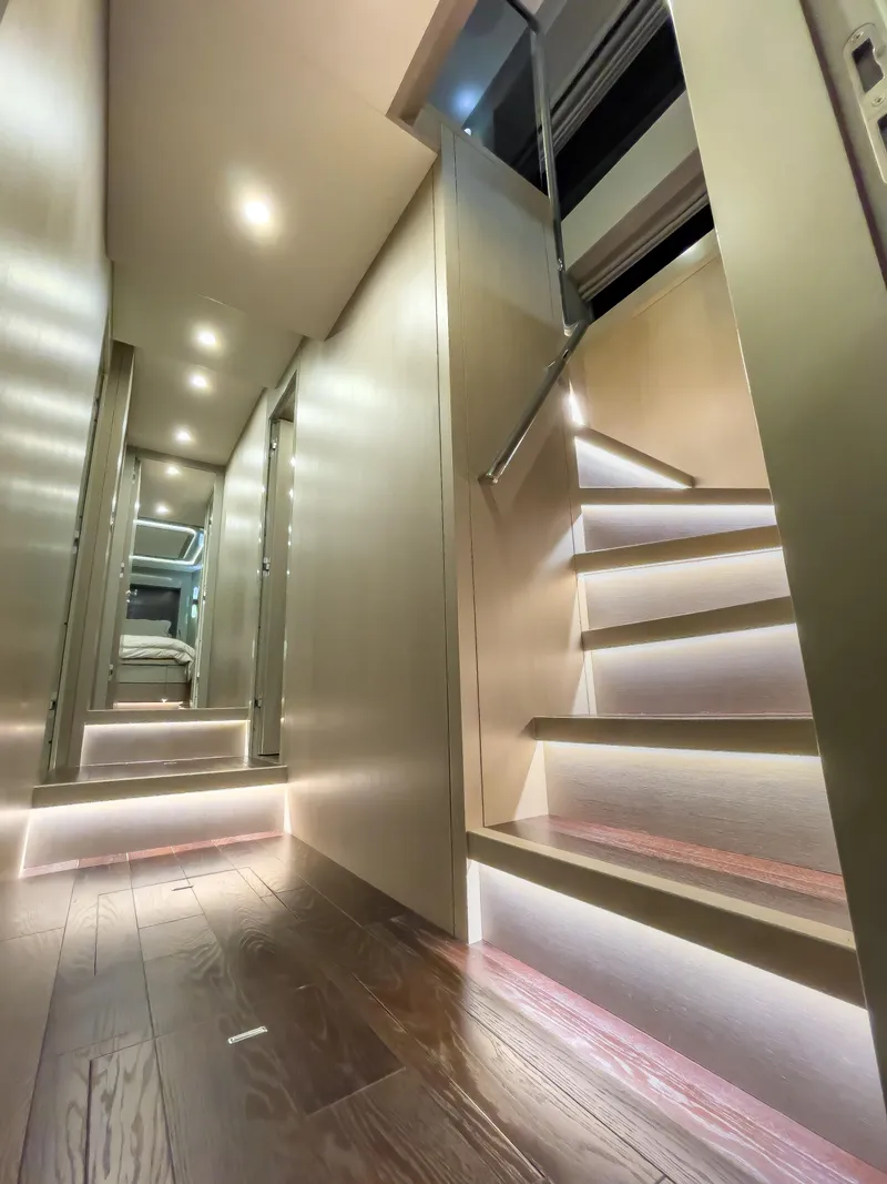 Slide: The Image of Modern interior of 2023 Sirena 68 yacht with illuminated stairs and hallway. - 19
