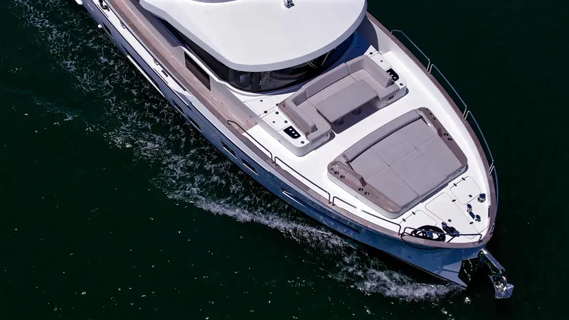 Slide: The Image of 2023 Sirena 68 yacht cruising on open water. - 6