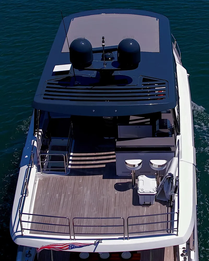 Slide: The Image of 2023 Sirena 68 luxury yacht, aerial view of spacious deck and modern design. - 7