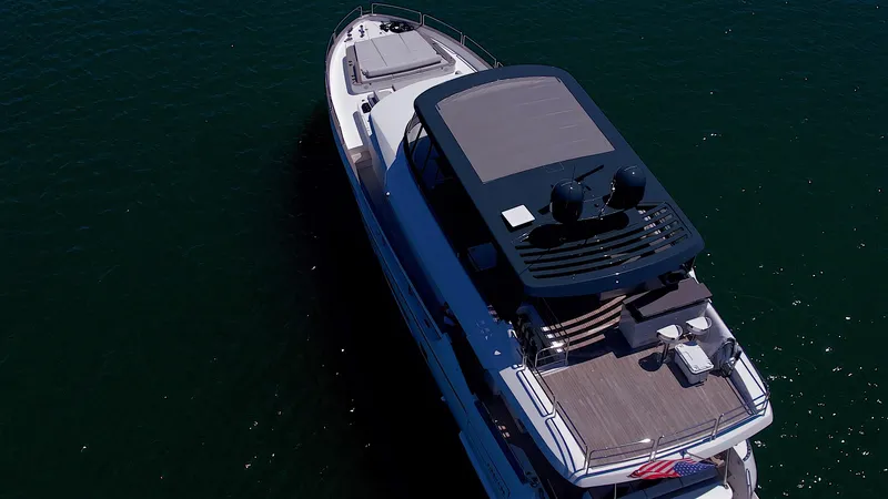 Slide: The Image of Aerial view of 2023 Sirena 68 luxury yacht on the water. - 8