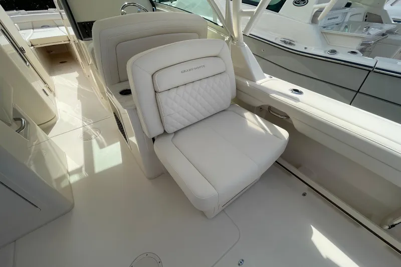 Slide: The Image of 2026 Grady-White Freedom 325 boat interior with luxurious seating and modern design. - 15