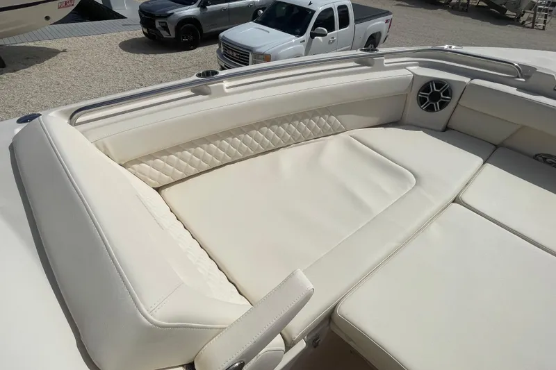 Slide: The Image of Luxurious seating on 2026 Grady-White Freedom 325 boat, featuring elegant white upholstery. - 3