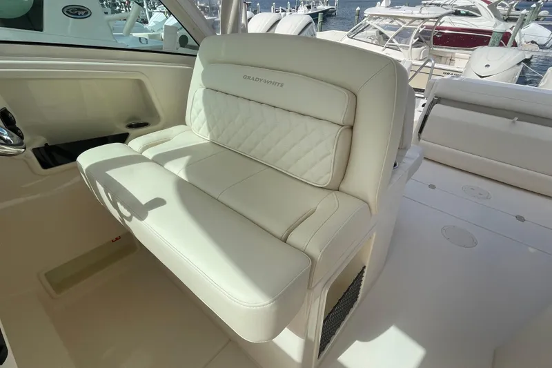 Slide: The Image of 2026 Grady-White Freedom 325 boat interior with luxurious white seating. - 6