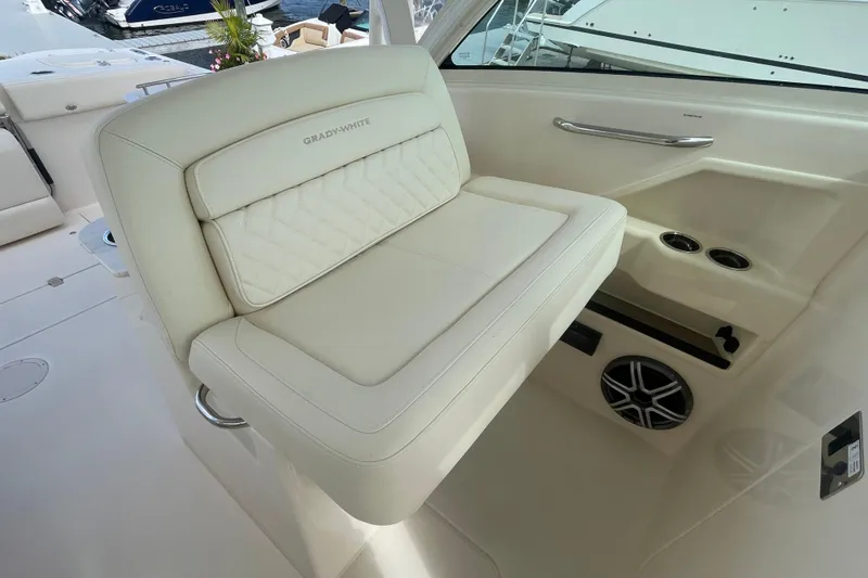Slide: The Image of 2026 Grady-White Freedom 325 boat interior with luxurious seating and cup holders. - 7