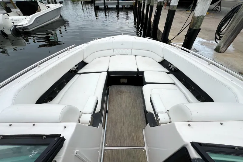 Slide: The Image of 2019 Regal 29 OBX boat with spacious white seating and sleek design at dock. - 21