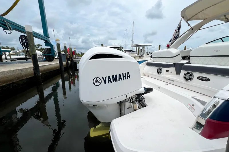 Slide: The Image of 2019 Regal 29 OBX boat with Yamaha outboard engine docked at marina. - 4