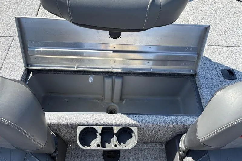 Slide: The Image of 2022 Tracker Pro Team 175 TF boat interior storage compartment with cup holders. - 10