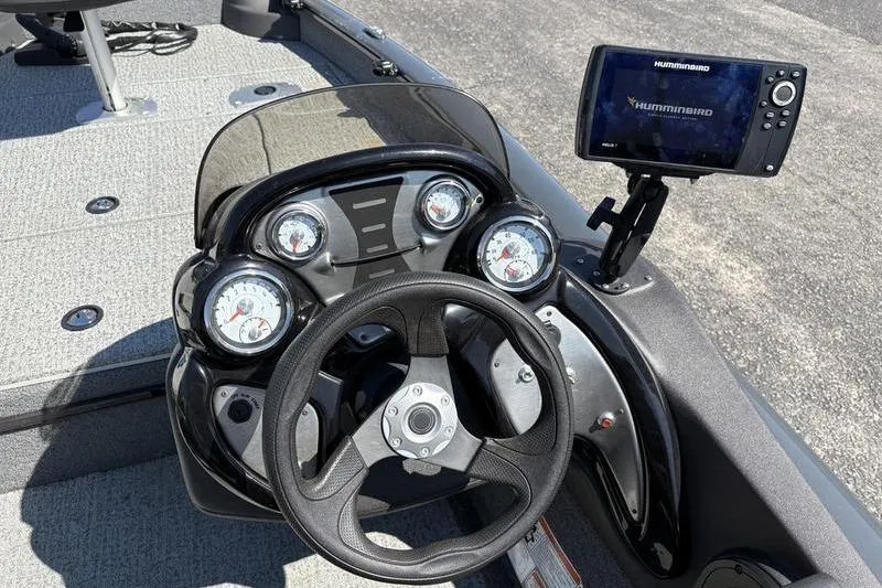 Slide: The Image of 2022 Tracker Pro Team 175 TF boat dashboard with steering wheel and Humminbird fish finder. - 11