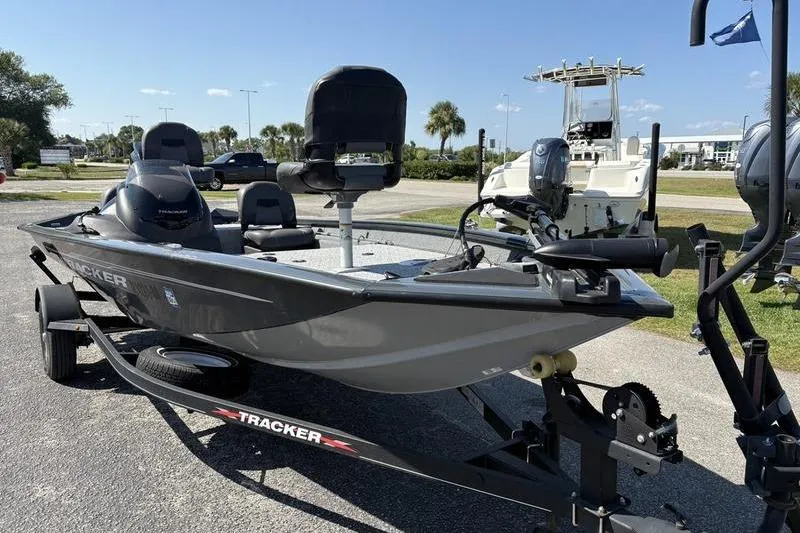 Slide: The Image of 2022 Tracker Pro Team 175 TF fishing boat on trailer, parked outdoors. - 6