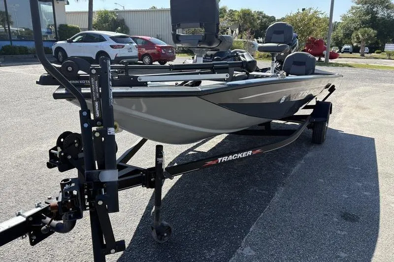 Slide: The Image of 2022 Tracker Pro Team 175 TF boat on trailer in parking lot. - 7