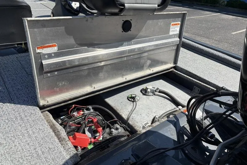 Slide: The Image of 2022 Tracker Pro Team 175 TF boat with open storage compartment and visible wiring. - 8