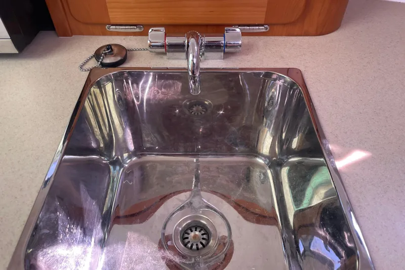 Slide: The Image of Stainless steel sink with chrome faucet in 2012 Hunt Surfhunter boat. - 16