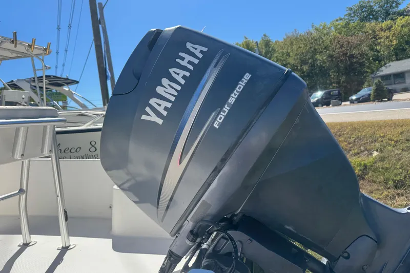 Slide: The Image of Yamaha four-stroke engine on 2006 Mako 171 Center Console boat, outdoors. - 11