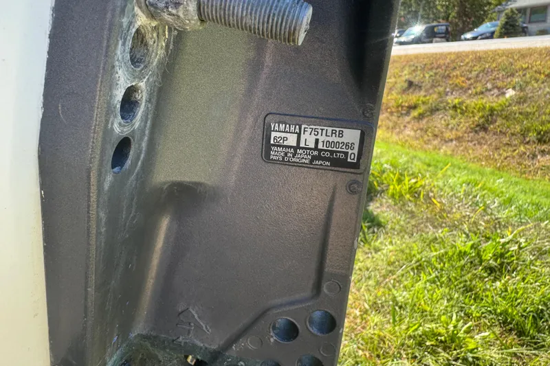 Slide: The Image of Yamaha F75TLRB engine label on 2006 Mako 171 Center Console boat. - 12