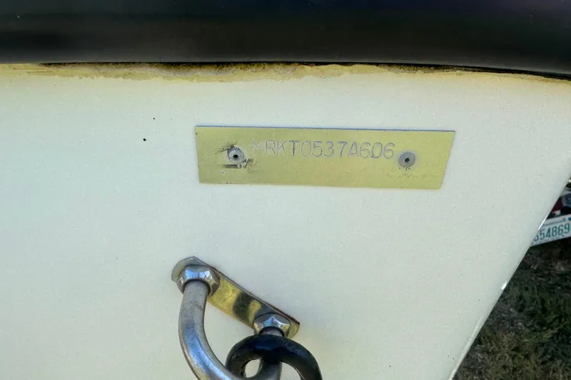 Slide: The Image of 2006 Mako 171 Center Console boat hull identification number plate. - 13