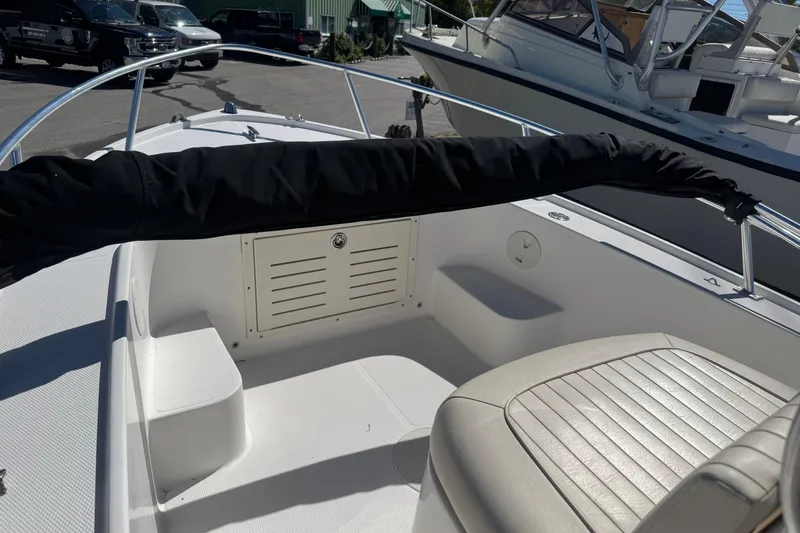 Slide: The Image of 2006 Mako 171 Center Console boat interior with seating and storage compartment. - 6