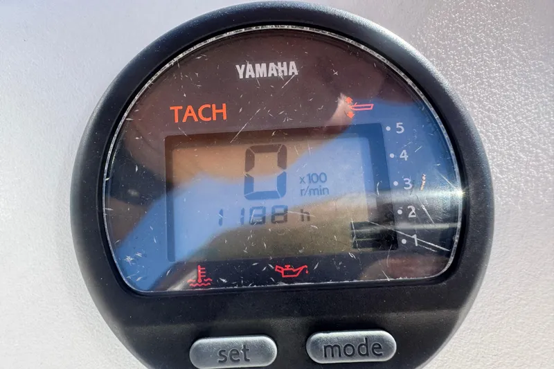 Slide: The Image of Yamaha tachometer displaying 0 RPM on a 2006 Mako 171 Center Console boat. - 9