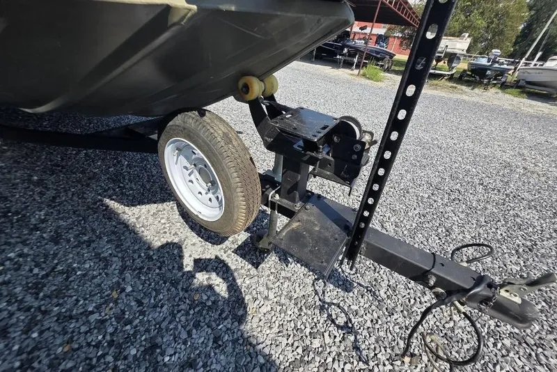 Slide: The Image of Trailer hitch and wheel of 2018 Tracker Grizzly 1648 on gravel surface. - 10