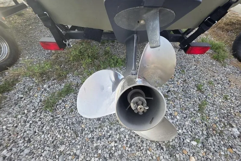 Slide: The Image of Propeller of 2018 Tracker Grizzly 1648 boat on gravel surface. - 15