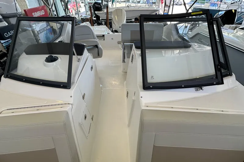 Slide: The Image of 2026 Boston Whaler 210 Vantage boat interior with dual consoles and seating. - 24