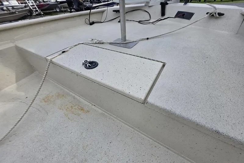 Slide: The Image of 2012 Xpress HD22CCF boat deck with ropes and fittings, showcasing clean design. - 4