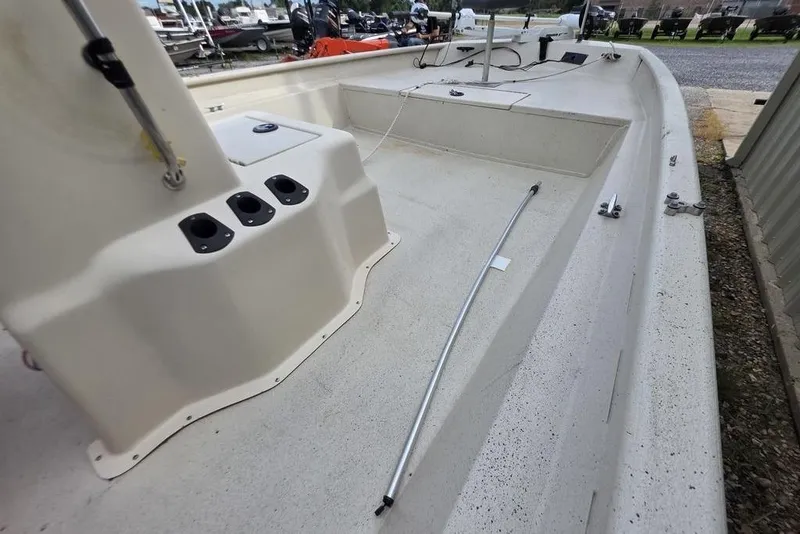 Slide: The Image of 2012 Xpress HD22CCF boat interior with console and rod holders. - 6