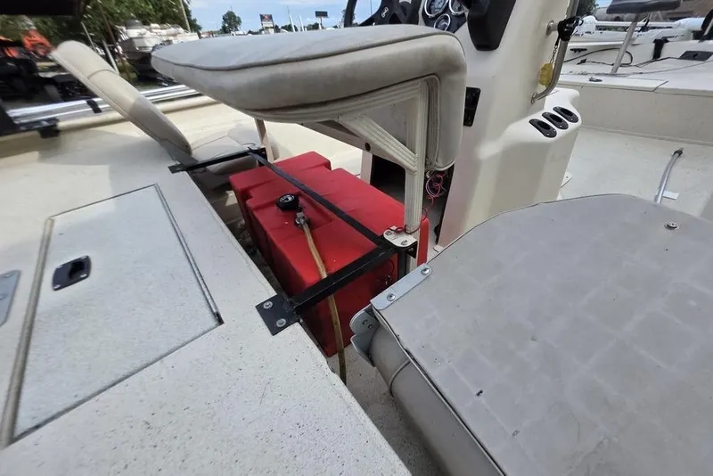 Slide: The Image of 2012 Xpress HD22CCF boat interior with red fuel tank and seating arrangement. - 9