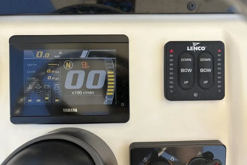 Slide: The Image of Yamaha display and Lenco controls on 2022 Scout 231 XSB boat dashboard. - 13