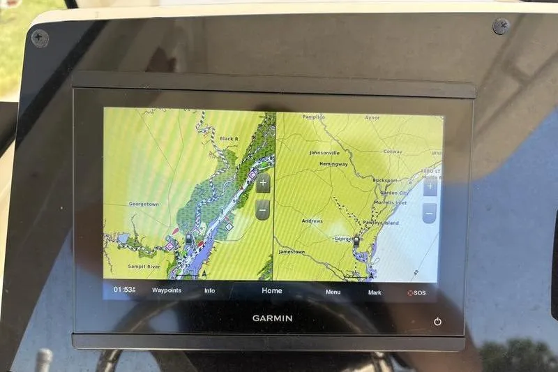 Slide: The Image of Garmin navigation display on 2022 Scout 231 XSB boat, showing detailed map and waypoints. - 16