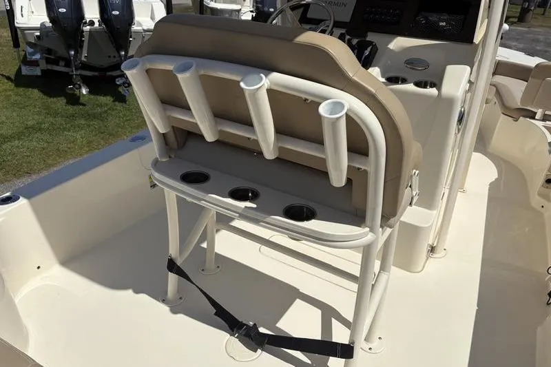 Slide: The Image of 2022 Scout 231 XSB boat interior with rod holders and seating. - 21