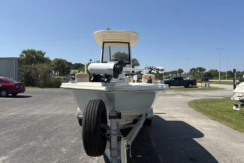 Slide: The Image of 2022 Scout 231 XSB boat on trailer in sunny outdoor setting. - 26