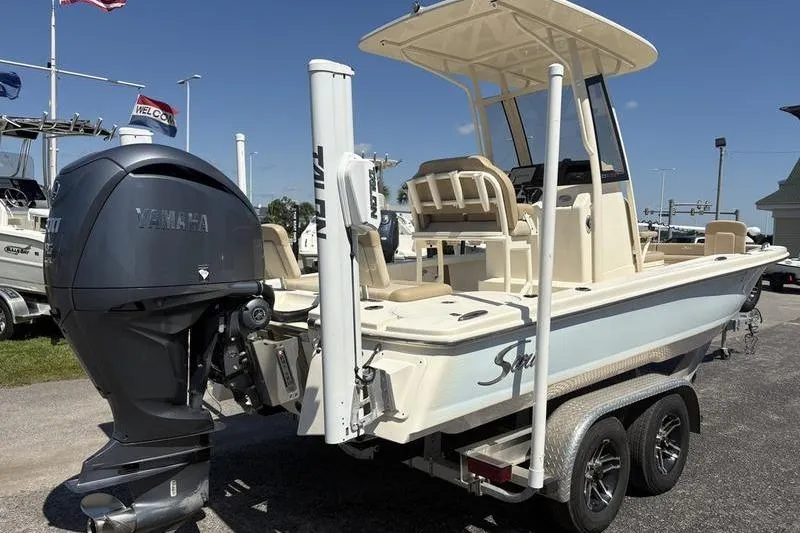 Slide: The Image of 2022 Scout 231 XSB boat with Yamaha outboard motor on trailer, sunny day. - 29