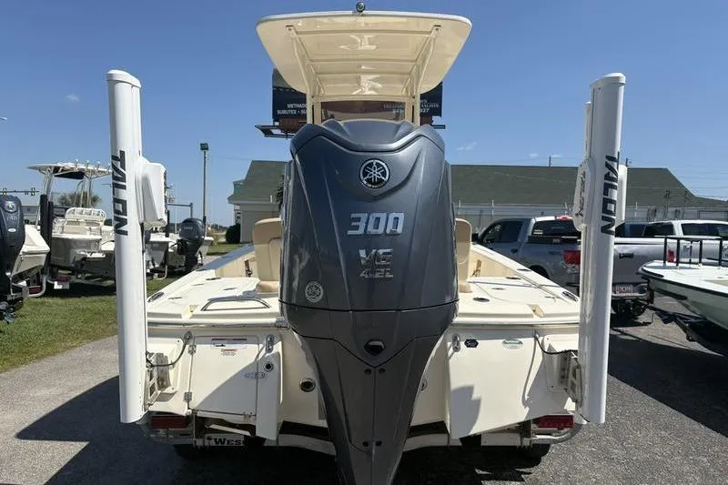Slide: The Image of 2022 Scout 231 XSB boat with Yamaha 300 V6 engine, parked outdoors. - 30