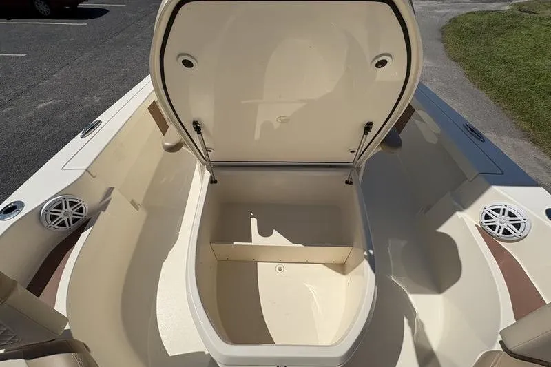 Slide: The Image of 2022 Scout 231 XSB boat storage compartment open, showcasing spacious interior design. - 5