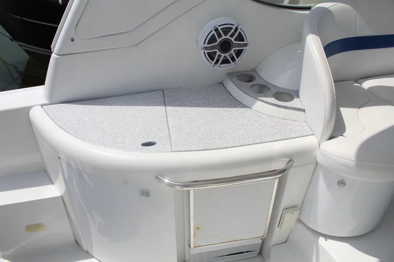 Slide: The Image of 2004 Formula 40 Performance Cruiser interior with seating, cup holders, and speaker. - 11