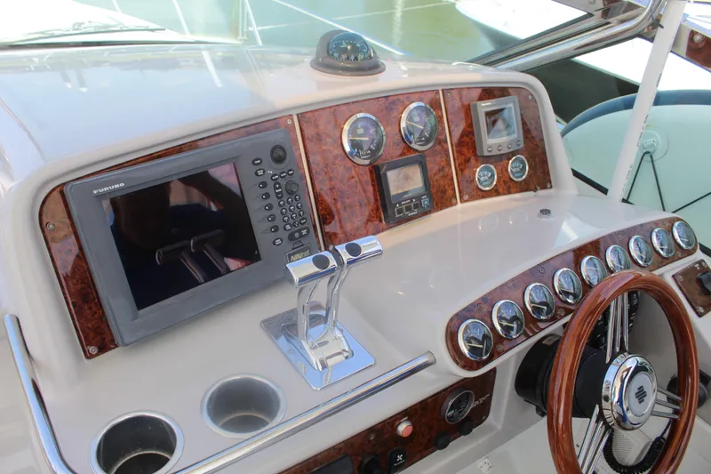 Slide: The Image of Control panel of a 2004 Formula 40 Performance Cruiser with navigation equipment and gauges. - 15