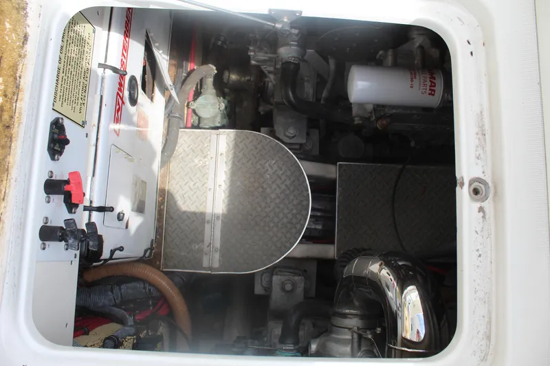 Slide: The Image of Engine compartment of a 2004 Formula 40 Performance Cruiser, showing mechanical components and controls. - 16