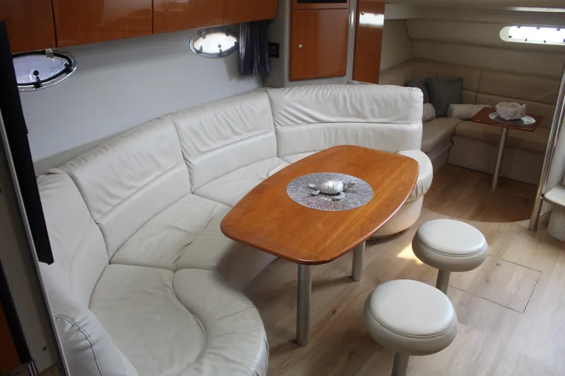Slide: The Image of Interior of 2004 Formula 40 Performance Cruiser with elegant seating and wooden table. - 23