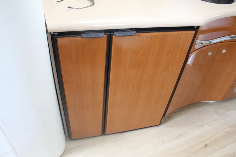 Slide: The Image of 2004 Formula 40 Performance Cruiser wooden cabinet doors in kitchen area. - 27
