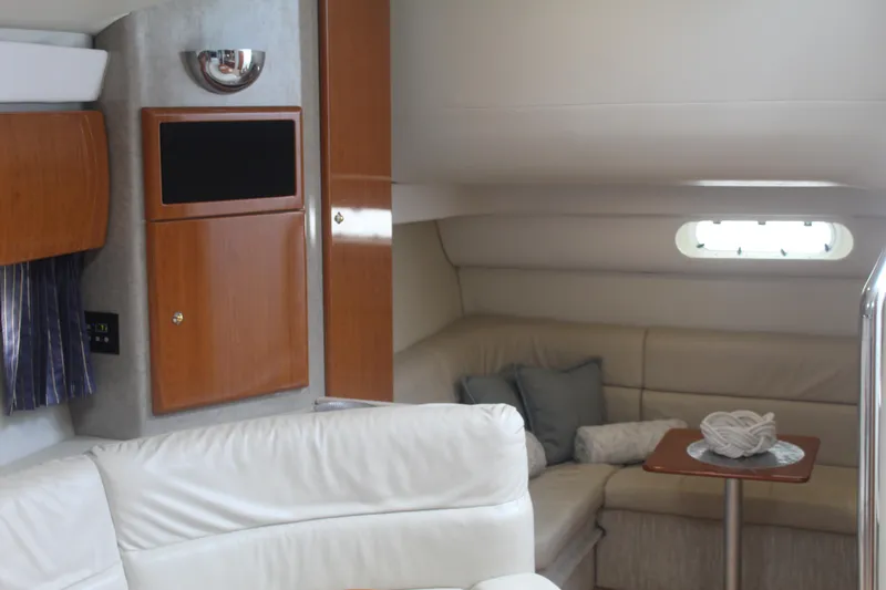 Slide: The Image of Interior of 2004 Formula 40 Performance Cruiser with white seating and wooden cabinetry. - 28