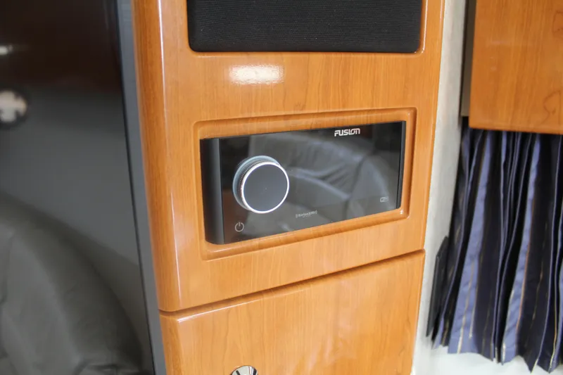 Slide: The Image of Wooden interior panel with Fusion audio system in 2004 Formula 40 Performance Cruiser. - 29