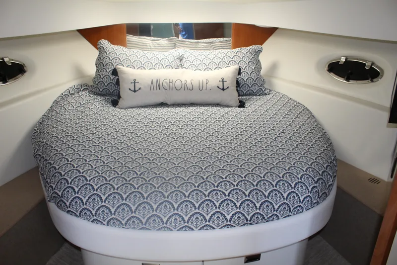 Slide: The Image of Cozy cabin interior of 2004 Formula 40 Performance Cruiser with nautical-themed bedding. - 31