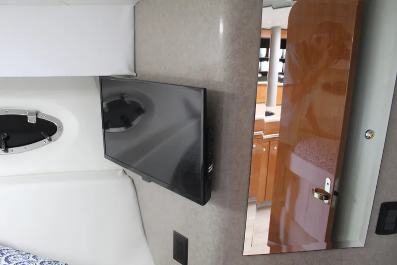 Slide: The Image of Interior of 2004 Formula 40 Performance Cruiser with TV and wooden door. - 32