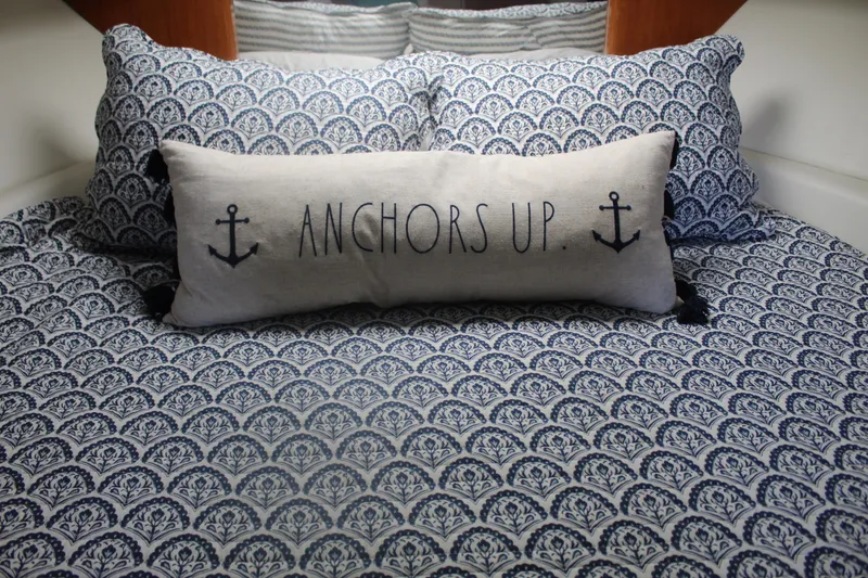 Slide: The Image of Nautical-themed bedding with "Anchors Up" pillow on 2004 Formula 40 Performance Cruiser. - 33